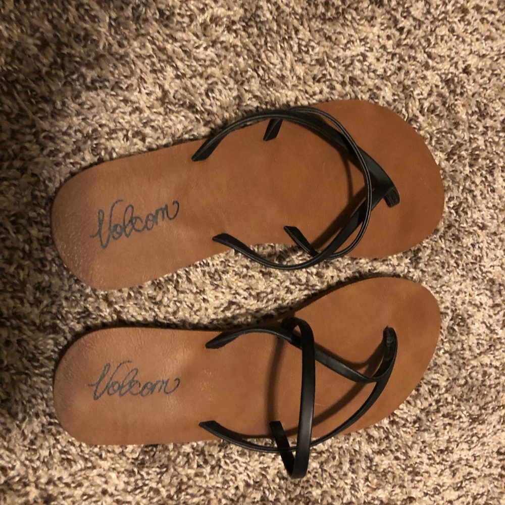 Volcom sandals with black straps.